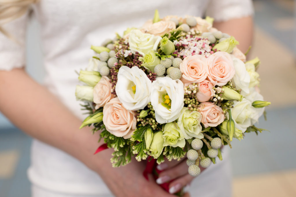 Pink bridal bouquet in bride's hands