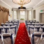 wide shot of the acorn suite set for a wedding ceremony at Mercure Bristol North The Grange Hotel in front of the large bay window