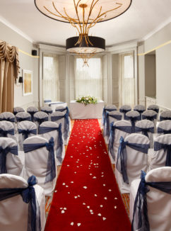 wide shot of the acorn suite set for a wedding ceremony at Mercure Bristol North The Grange Hotel in front of the large bay window