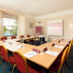 Cedar meeting room ready for a meeting at Mercure Bristol North The Grange Hotel with a view out of the window