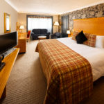 Image of a family room with double bed and sofa bed at Mercure Bristol North The Grange Hotel