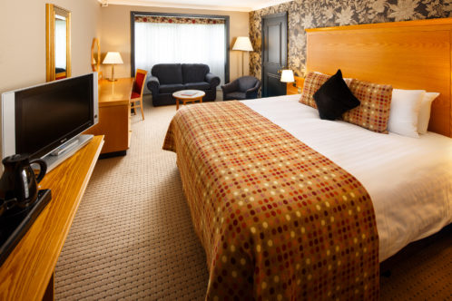 Image of a family room with double bed and sofa bed at Mercure Bristol North The Grange Hotel